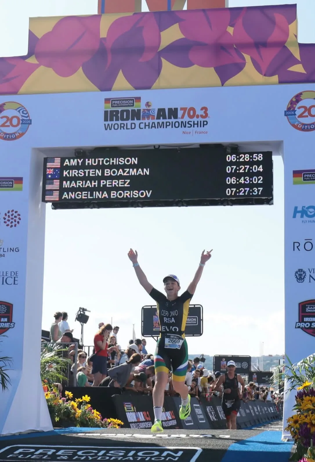 Mikha Ceronio crossing the IRONMAN 70.3 World Championship finish line in Nice with both arms raised